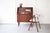 A neat and stylish teak secretary desk, crafted in the 1960s in Denmark with a pull out table top. The upper section...