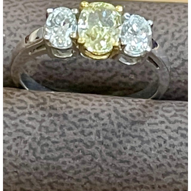 GIA certified 1.01 Carat Yellow Diamond and 1 Ct White Diamond Three Stone Engagement Ring in 18 Karat White Gold GIA...