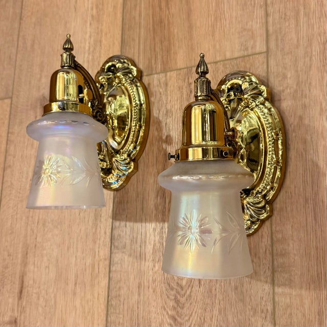 Vintage stamped brass professionally polished and lacquered sconces rewired and supporting vintage iridescent etched...