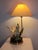 Magnificent vintage table lamp. Italy, 1980s. Brass structure. Black lacquered metal base with a brass band. Two resin...