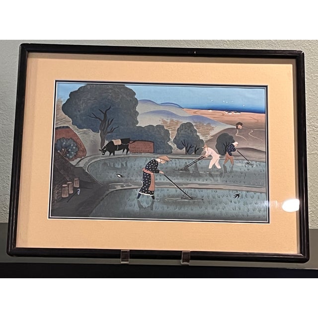 Up for sale is a vintage Japanese woodblock print depicting farmers tending to a flooded rice paddy with an ox and rolling...