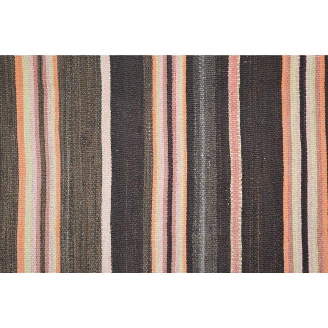 Flatweaved with care using traditional rug-making techniques, this wool rug blends timeless craftsmanship with a modern...