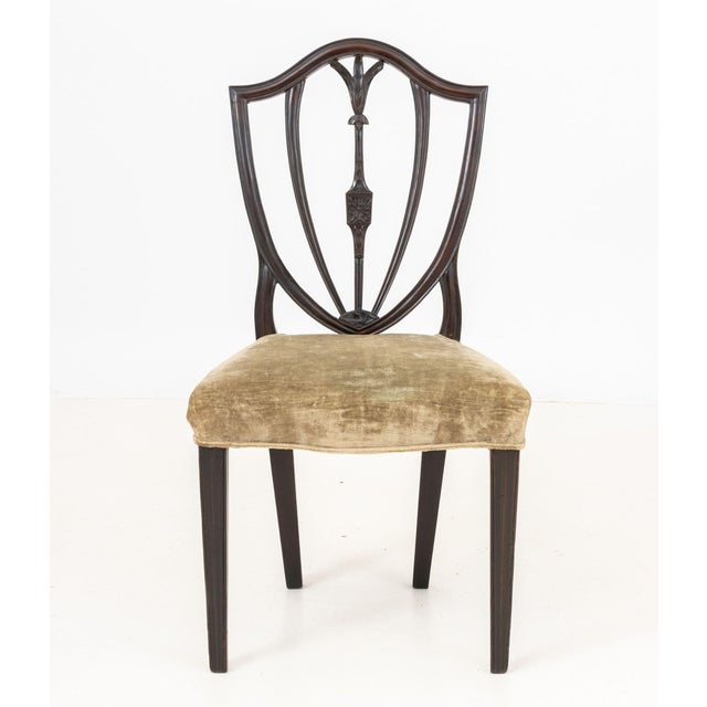 Hepplewhite Style Mahogany Occasional Chair, the seat upholstered in sage green chenille, the reticulated shield form back...