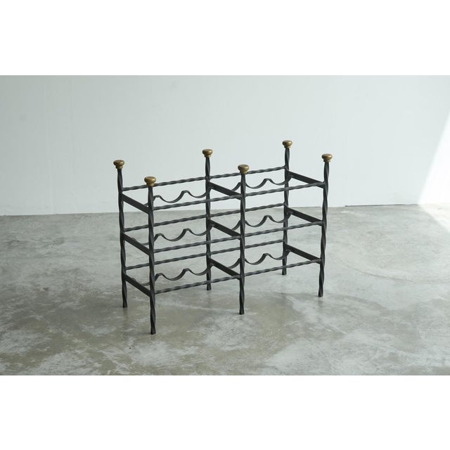Mid Century Wine Rack in Wrought Iron Brass, Europe, 1960s. This is a great mid century wine rack in wrought iron with...