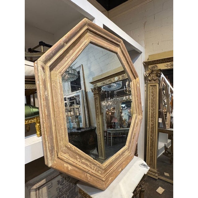 The Mid Century French Octagonal Stripped Pine and Gesso Mirror is a unique and stylish piece of furniture. This antique-...