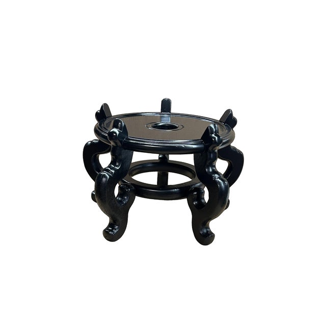 This elegant, traditional display stand is crafted from wood with a deep, lustrous black lacquer finish that catches the...