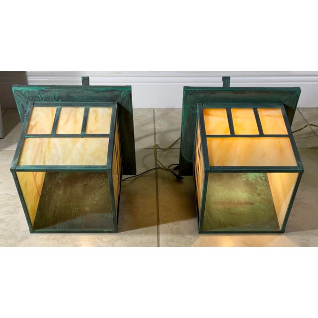 Elevate your home’s curb appeal with this pair of vintage solid brass wall-mount lanterns. These fixtures embody the Arts...