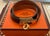 Hermès Kelly Double Tour Bracelet in black leather with brown felt bag and iconic orange logo box for storage. Double...
