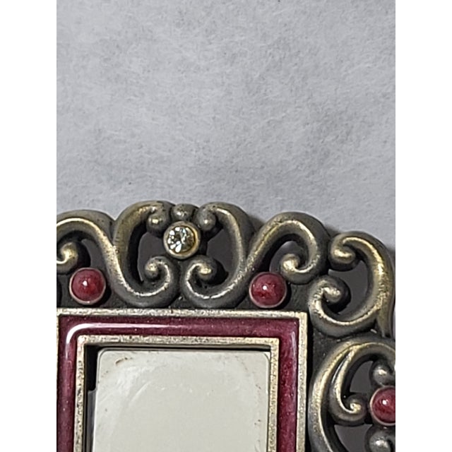 A lovely and very petite Jay Strongwater Picture frame. Great for the bedside or desk. The back has the options of setting...