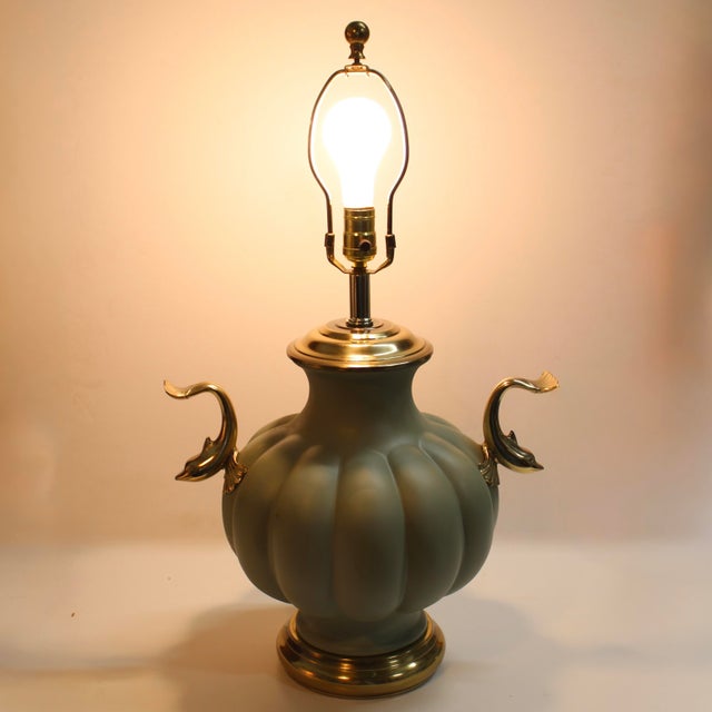 Round fluted painted pale green ginger jar table lamp with dolphin koi handles on each side. Wonderful lamp, high quality...