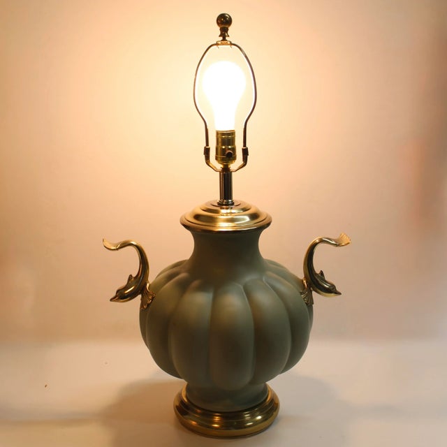 Round fluted painted pale green ginger jar table lamp with dolphin koi handles on each side. Wonderful lamp, high quality...