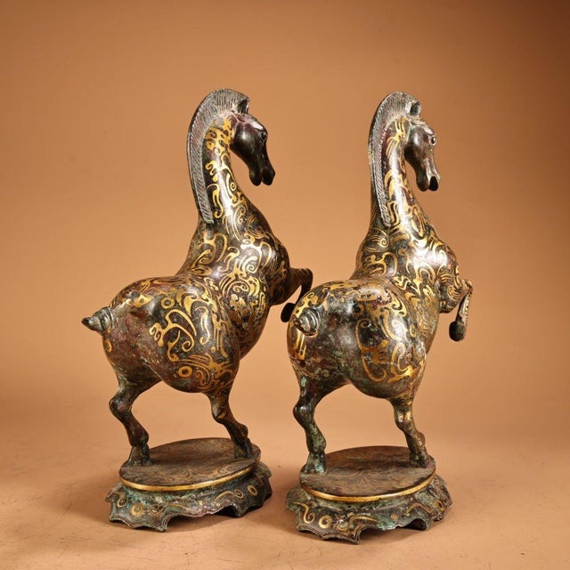This is a dynamic pair of vintage Chinese bronze sculptures depicting prancing or rearing horses. Crafted from solid...