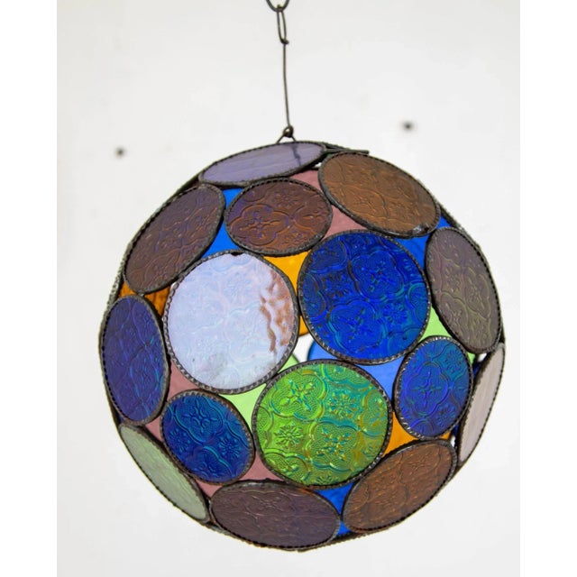 Handcrafted vintage Moroccan multi-color glass lantern or Moorish pendant. Multi-color molded glass colors in blue, green,...