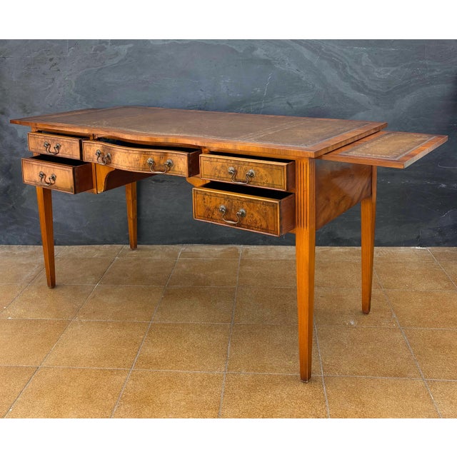 Elegant Georgian Revival writing desk crafted in hardwood, dating to the mid-20th century. The desk features a refined...