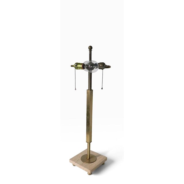 Classic architectural mid century modern table lamp, having a squared brass vertical center post, mounted on a square...