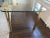 Gorgeous Mid-Century glass and brass dining table. I had this in the center of my previous loft-like apartment and...