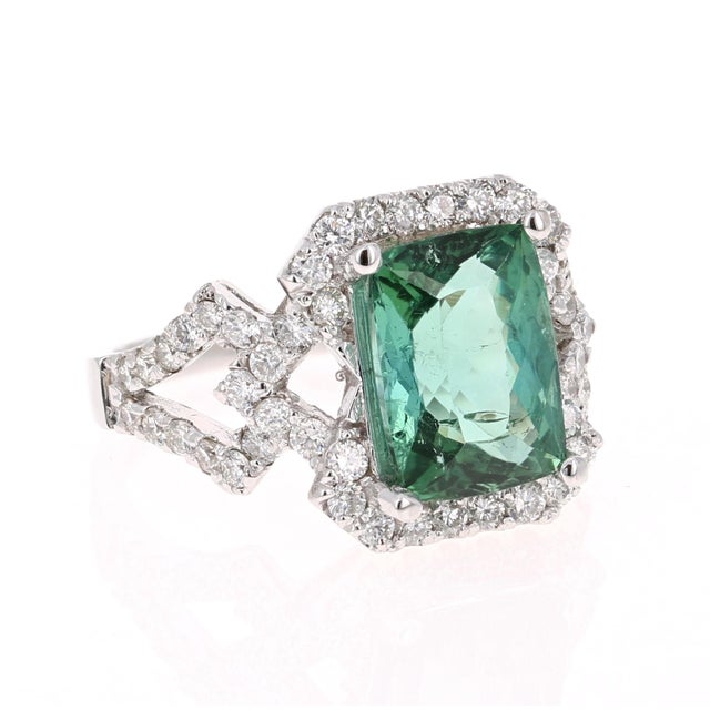 Gorgeous & Unique Cocktail Ring! This ring has a STUNNING Emerald Cut Green Tourmaline that weighs 3.83 Carats. Floating...