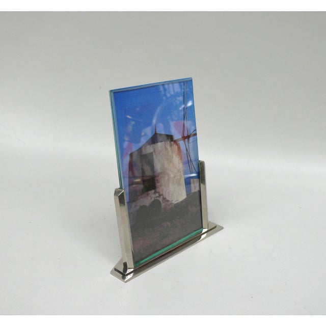 A picture frame made in France in the 1920s/30s. It takes up the reduced design language of this time and is at the same...