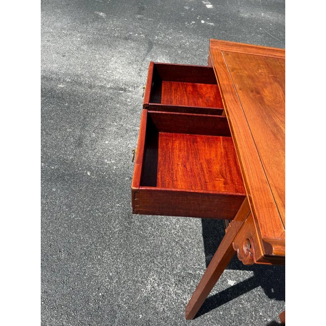 I have never seen this unique Asian desk. It is brown wood with a flared pagoda top. The design resembles an altar table...
