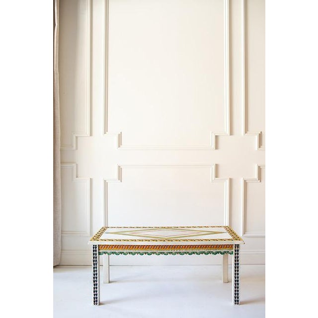 Add a dash of whimsy to your home with this cheerful Scandinavian style coffee table. Its playful carvings, scalloped...