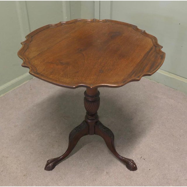 19th Century Tilt Top Wine Table This lovely table stands on a three footed Ball and Claw base carved with acanthus leaves...