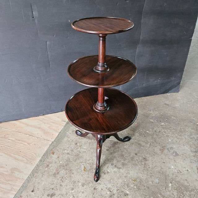 This Mahogany 3 Tier Spoon Foot Pedestal Base Dumbwaiter would originally have been used in dining rooms to hold extra...