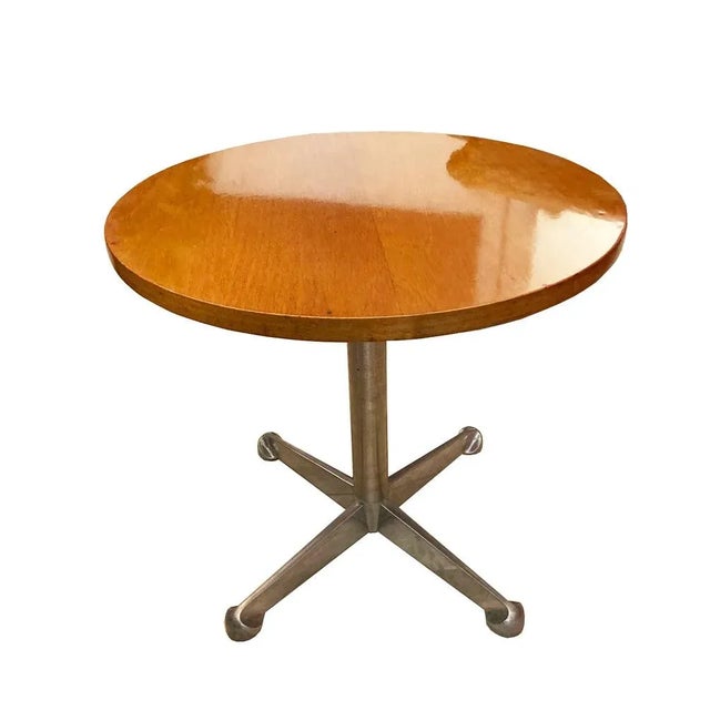 Osvaldo Borsani, a coffee table with a wooden top and an steel structure. Tecno Prod., Italy, 1960s. This piece has an...