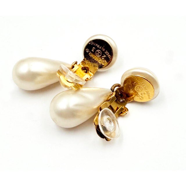 Chanel Vintage Gold Plated CC Pearl Tear Drop Dangle Clip on Earrings *Marked 23 *Made in France *Comes with the original...