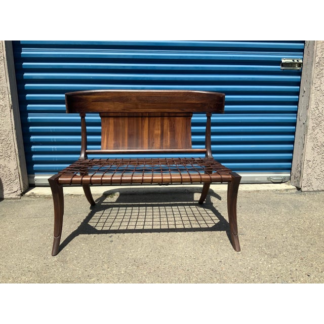 Modern walnut Klismos style settee/bench. The bench is made of solid walnut. The leather cording on seat is flawless. The...