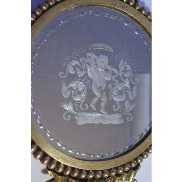 Simply gorgeous pair of authentic E.F. Caldwell early 20thc Bronze with original mirrored Carved Eglomise of Cavorting...