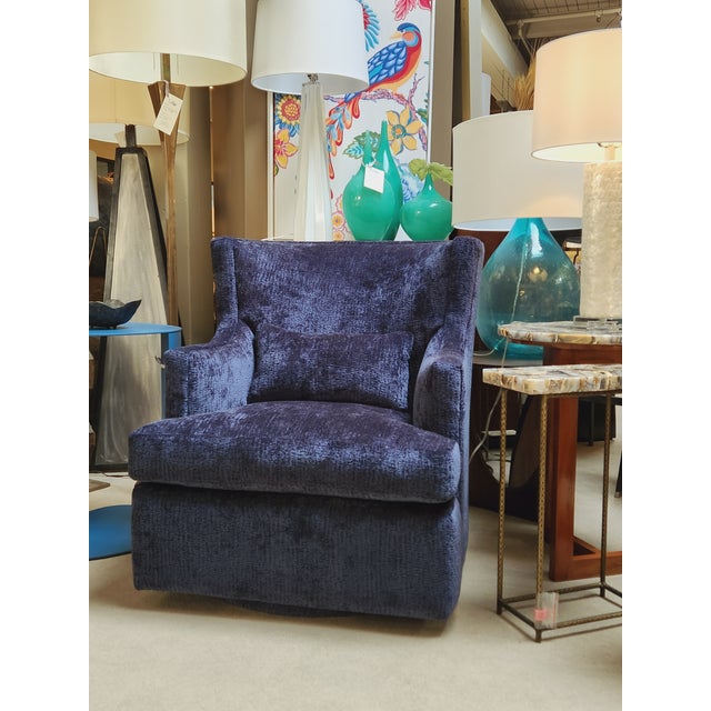 Dimensions: 29"W x 34"D x 34"H Custom Burton James Petite Blue Wing Swivel Chair The traditional wingback design lends a...