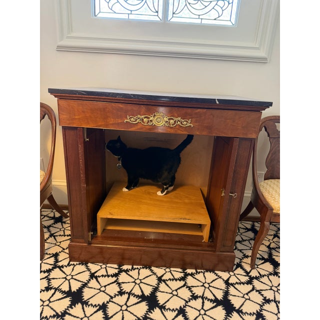 Multi-functioning side table with black and white marble top. Piece was converted to a TV cabinet with inset doors and...
