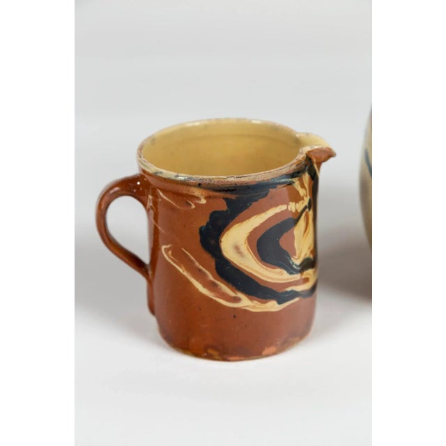 Two Antique Jaspé Pottery Pitchers, France, Late 19th Century. Striking marbleized slip application. From the Savoie...
