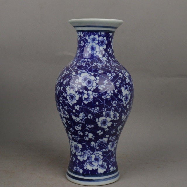 This is a magnificent pair of vintage Chinese porcelain vases, styled in the classic "Fish Tail" (鱼尾瓶) shape with a flared...