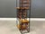 A mid century modern iron frame wine rack with brand new leather straps to hold 40 bottles of wine designed by Arthur...