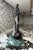 Vintage Frederic Remington style sculpture featuring a Native American rider on horseback in a dramatic pose. Mounted on a...