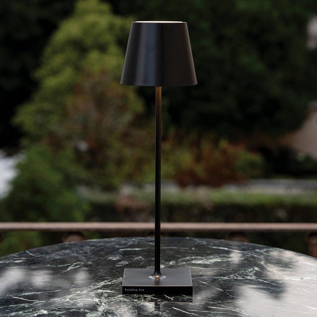 Battery-operated and rechargeable portable table lamp. The lamp features dimming touch control and has 3-CCT color...