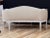An elegant Swedish Gustavian canapé, settee, circa 1800–1830, featuring a gently arched back and open arms terminating in...