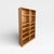 A tall vintage oak bookcase with a balanced double-column layout, warm natural finish, and open shelving for books,...
