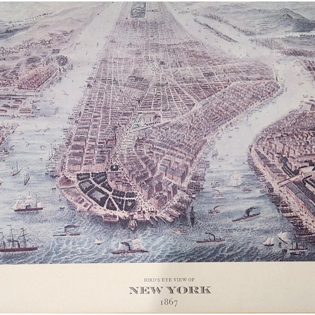 A beautifully framed reproduction of the iconic 1857 panoramic map of Manhattan and New York Harbor, rendered in soft...
