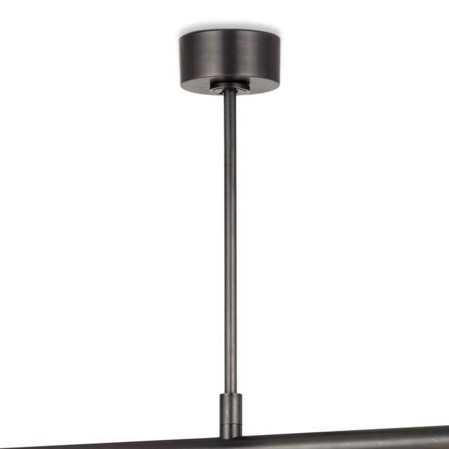 Four arms swivel around a center point on our modern, linear Wick Chandelier. Create a unique, dynamic design in your...