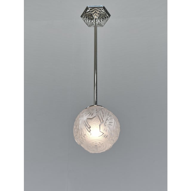 Muller frères A pair of French 1925-1935 art deco pendants in nickel plated solid brass or bronze holding ball shaped...