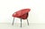Striking mid-century modern lounge chair with a bold circular design and suspended red suede seat. The bowl-shaped form...