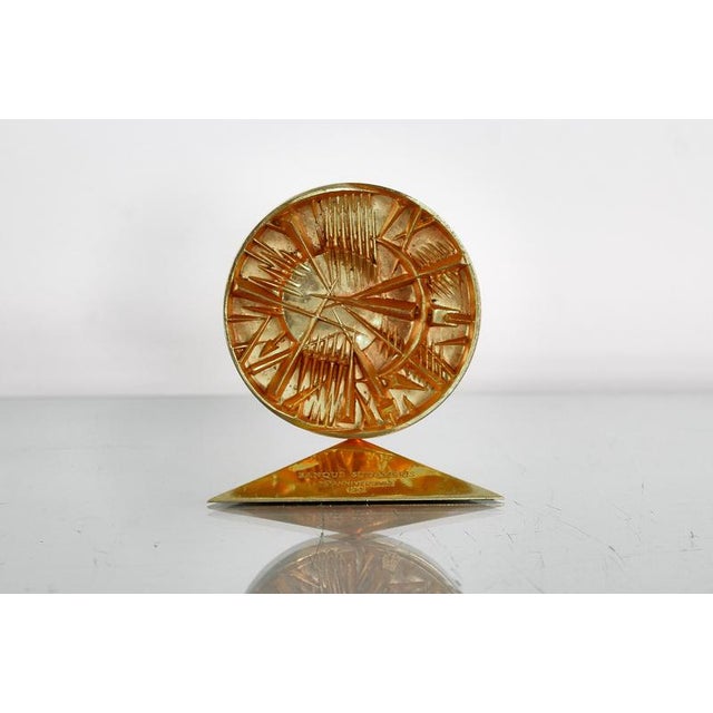 Gilded bronze multiple "Disco Del Sole" by Arnaldo Pomodoro, created for the 75th anniversary of Banque Sudameris in 1985,...