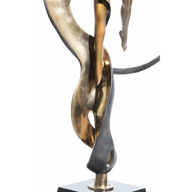 Beautiful and important sculpture realized in bronze with different patinas, on a black marble base. Edition of 175....