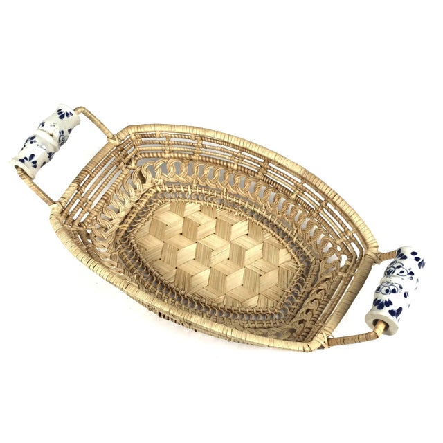 This antique basket is in unbelievably great condition. It has porcelain Delf Design handles and the design is very...