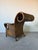 Striking vintage coastal lounge chair and matching ottoman crafted entirely in richly toned woven rattan. Featuring...