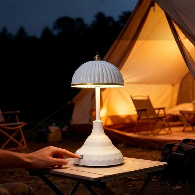 White porcelain vertical-texture shade (with small gold bead finial), layered white porcelain lamp body (with glowing...