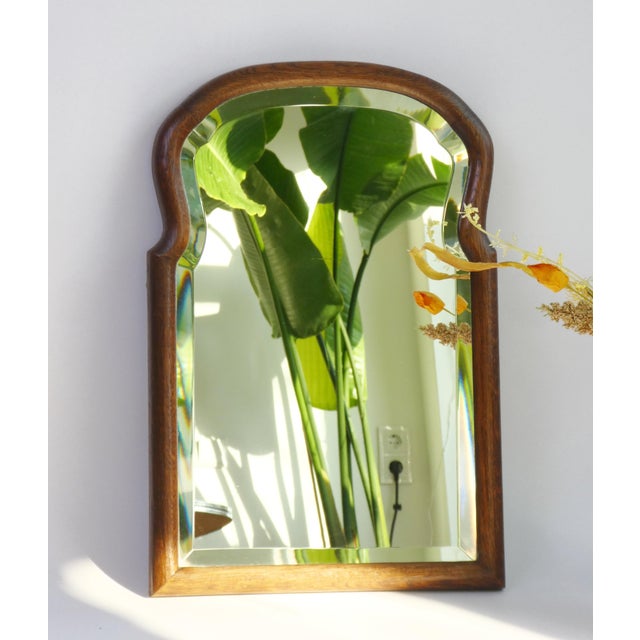 Antique arched wooden scalloped mirror with a nice frame and beveled glass made in the Netherlands. The mirror dates back...