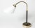 Rare, elegant brass table or desk lamp by Josef Frank, with original leather upholstery with some patina on the stem and...